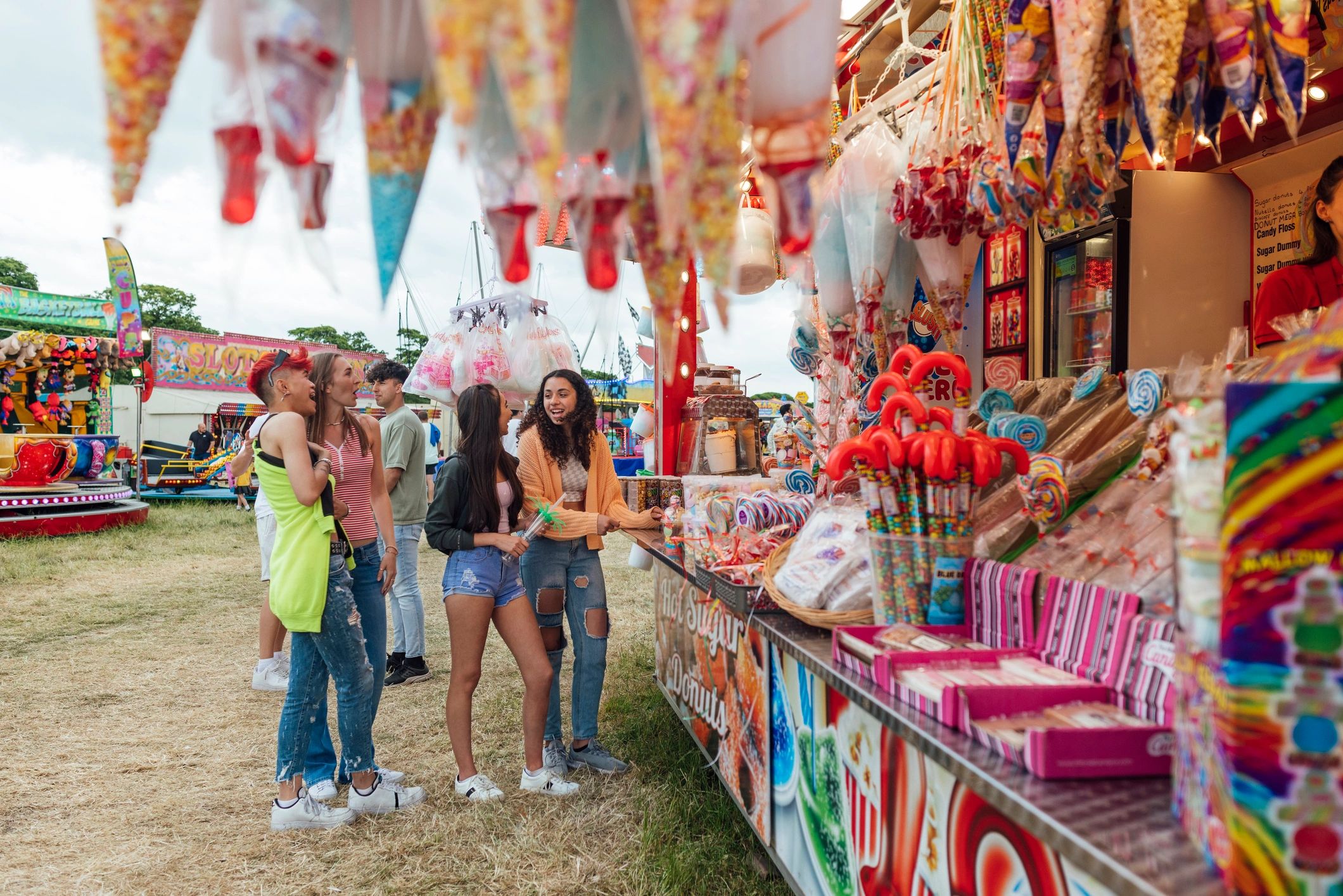 Guests gathering around a vendor stand at an outdoor market