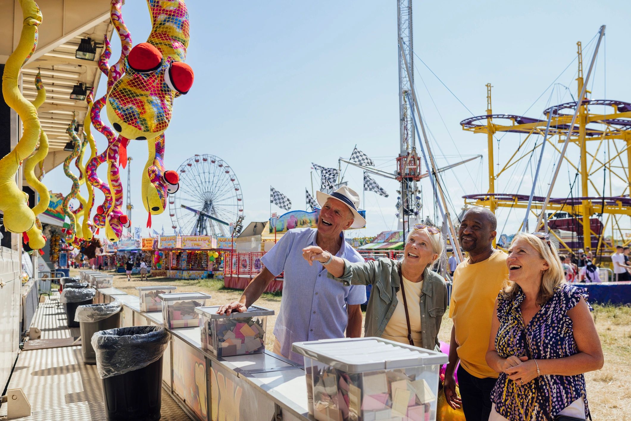 Visitors interacting at an outdoor event booth